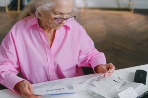 Senior woman reviewing universal life insurance policy documents