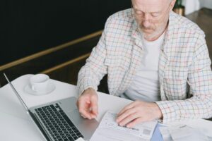 Senior citizen reviewing life insurance documents